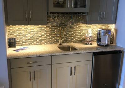 kitchen cabinets and countertop with backsplash