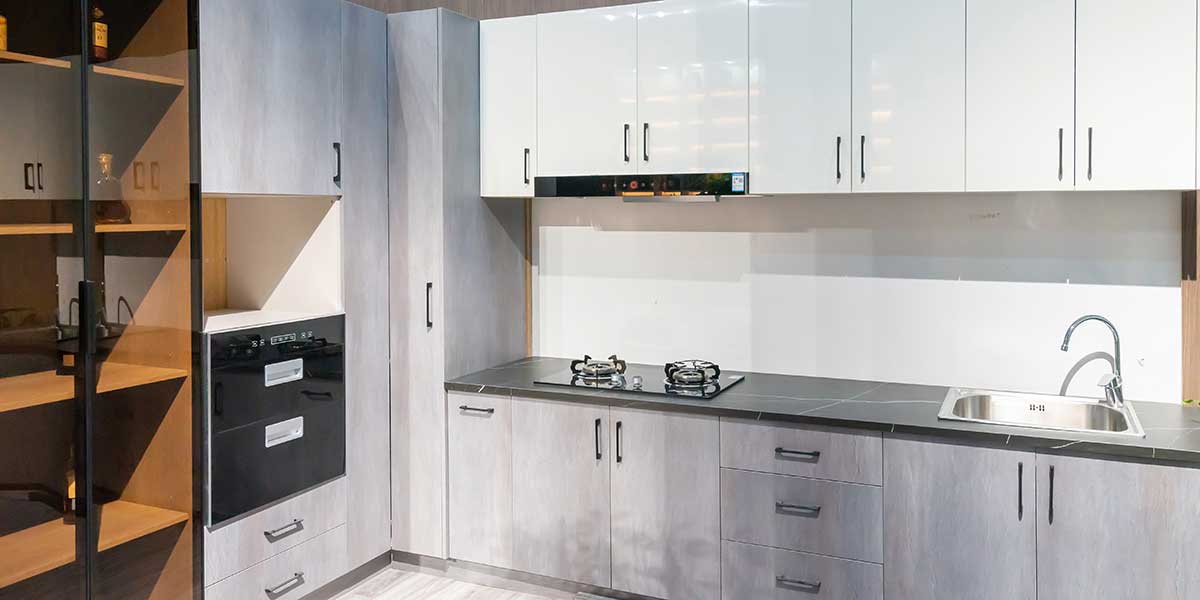 Modern Kitchen Cabinet Design Modern kitchen featuring white upper cabinets, grey wood-grain lower cabinets, dark countertops, and a built-in stovetop with sink.